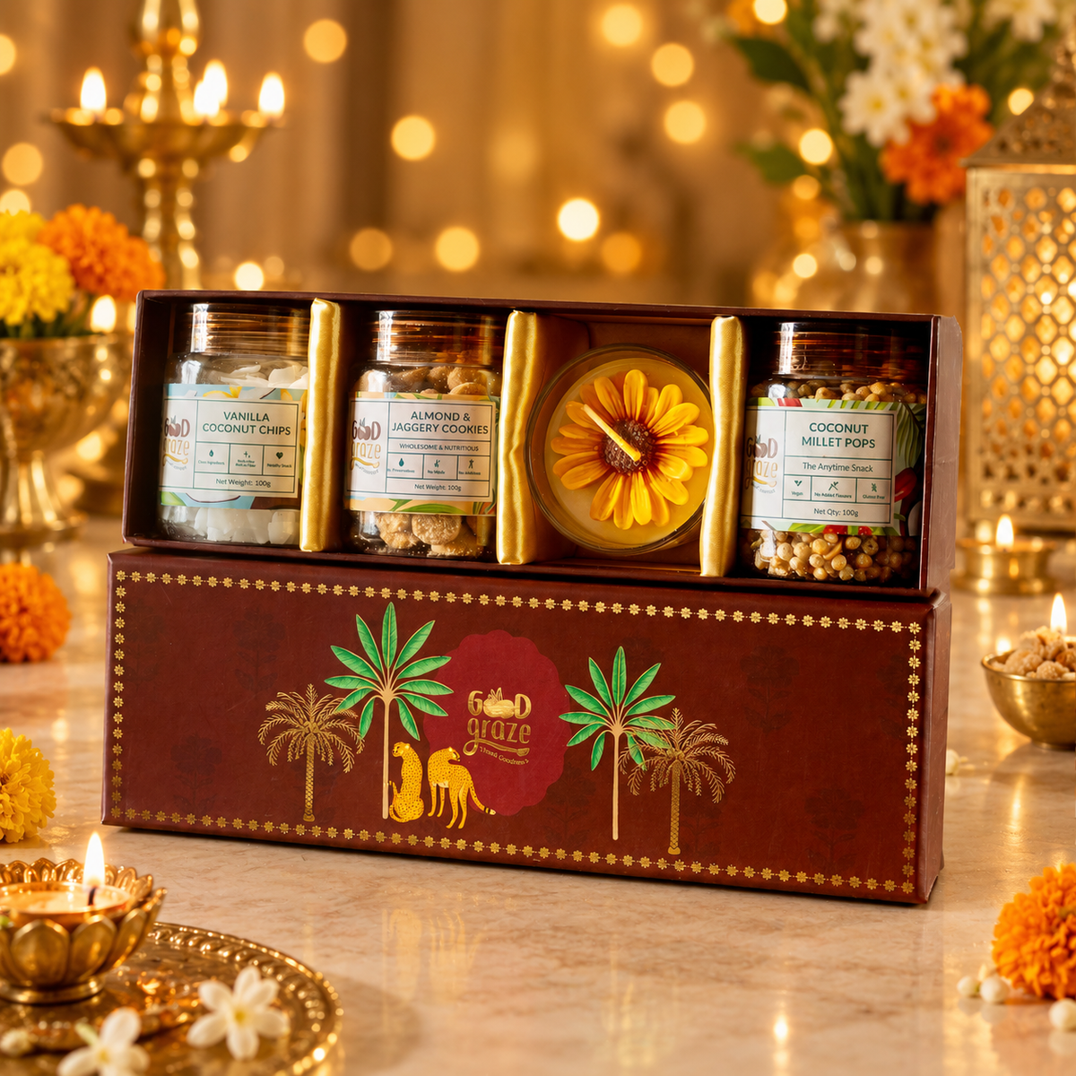 Crimson Canopy Diwali gift hamper with jaggery cookies, coconut chips, millet pops and a scented candle